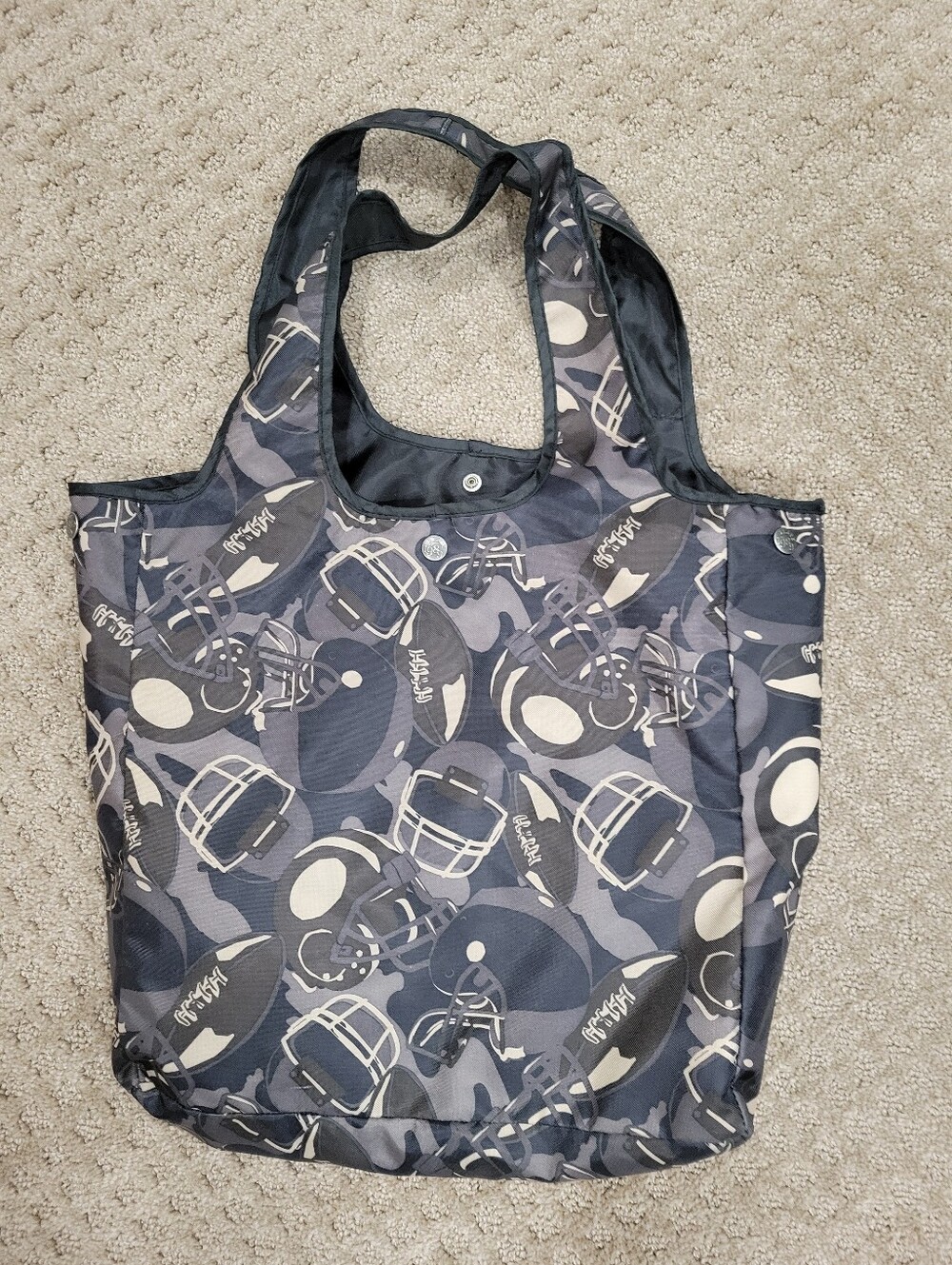 Double handle bag, snap closure, flat bottom, football pattern, like new